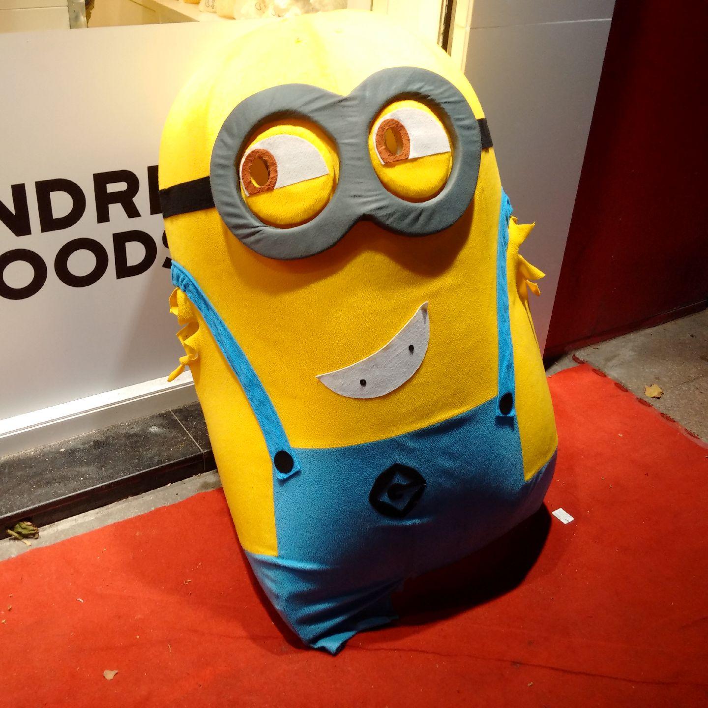 A poor minion I saw on the street today. He has no hands (somebody must have torn them apart) but he's still happy. Is he?