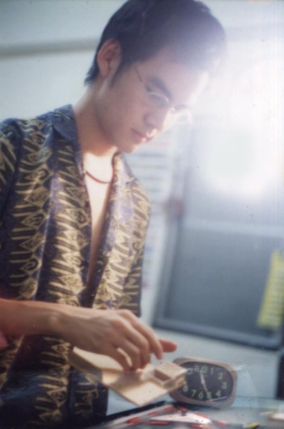 Me, making an architectural model at my dorm room in the technical college that I was a student at. Photo credit: Attakorn Engchuan.
